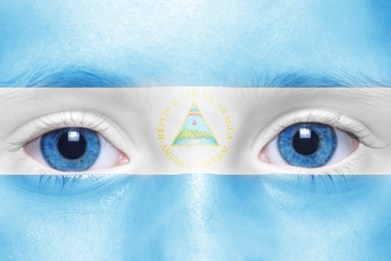 human's face with nicaraguan flag