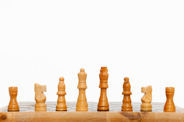 Cream colored wooden chess pieces