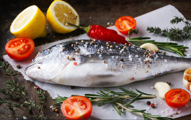 Fresh fish dorado with fragrant spices, herbs and spices