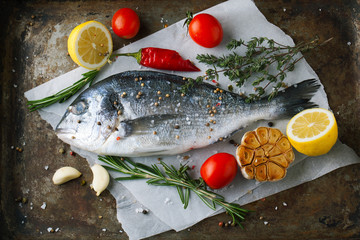 Fresh fish dorado with fragrant spices, herbs and spices