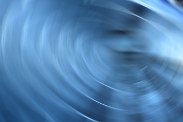Abstract blue spinning lights line background