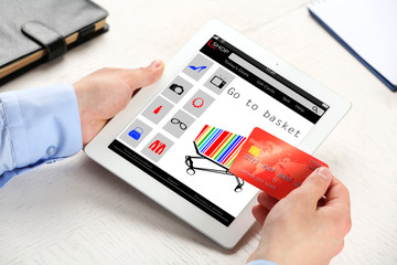 Man shopping online with digital tablet