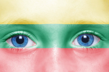 human's face with lithuanian flag