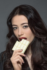 Portrait of fashion lady with white chocolate