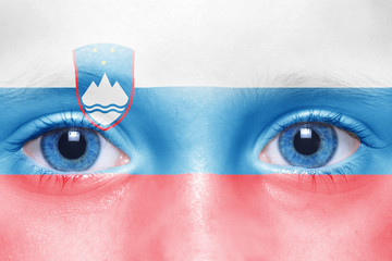 human's face with slovenian flag