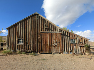 Fototapeta na wymiar Old vintage wooden barn building exterior - landscape color photo