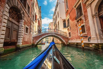 Wall murals Gondolas View from gondola during the ride through the canals of Venice i
