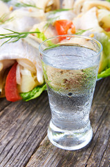 Cool vodka shot glass and herring