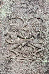 Historic Khmer bas-relief showing dancing Hindu godesses at Bayon temple, Cambodia