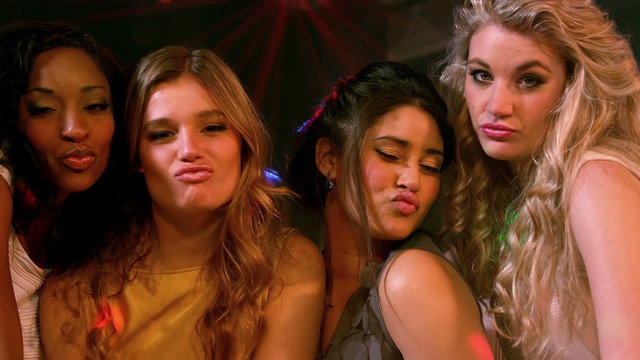 Group of friends doing duck face at the camera