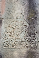 Historic Khmer bas-relief showing dancing Hindu godesses at Bayon temple, Cambodia