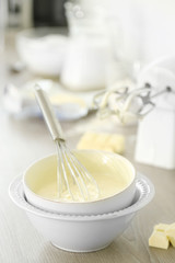 Cooking buttery cream on kitchen