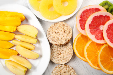 Fruits on light wooden background. healthy eating concept.