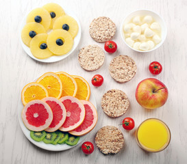 Fruits and vegetables on light wooden background. healthy eating concept.