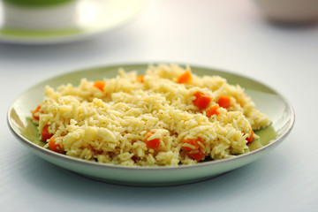 Stewed rice with a carrot on a , close up