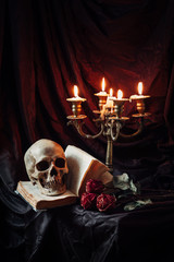 Still life with skull, book and candlestick © grape_vein