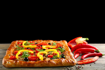 Freshly homemade pizza on black background
