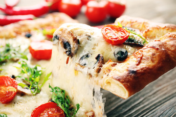 Piece of freshly homemade pizza closeup