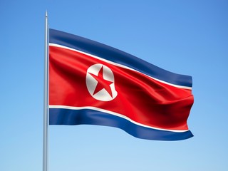 North korea 3d flag floating in the wind with a blue sky background