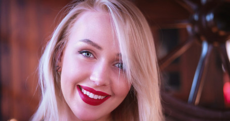 Beautiful blonde woman smiling to the camera