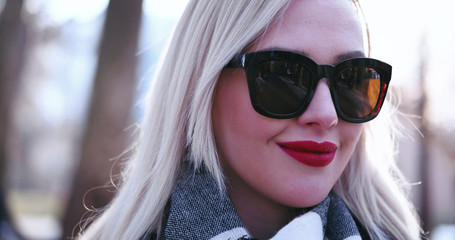 Beautiful blonde woman smiling to the camera