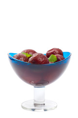 Plum Compote Isolated on a white background. Selective focus.