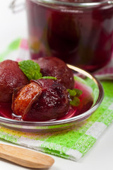 Whole Plum Compote. Selective focus.
