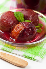 Whole Plum Compote. Selective focus.