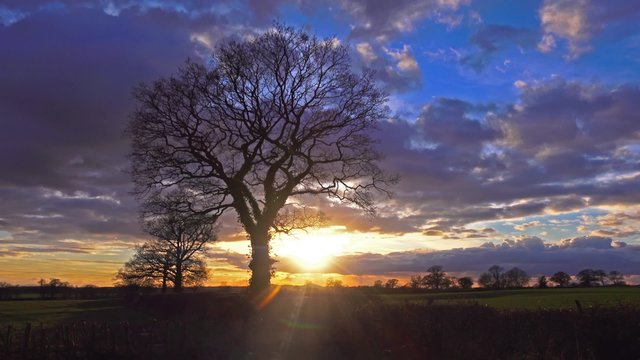 evening sunset over countryside winter landscape time lapse 
