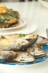 fried mackerel fish on with table