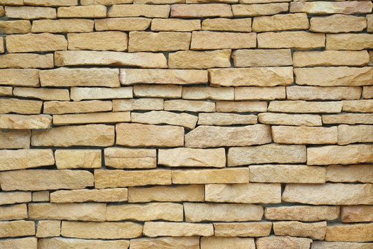 Exterior brown brick wall, textured wall background.
