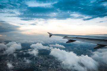 Clouds and sky as seen through window of an aircraft