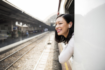 Asian Lady Traveling Commute Train Concept