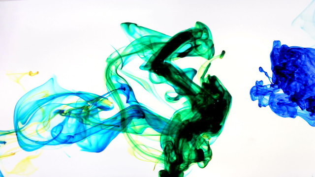 Color Ink flowing in water on white background
