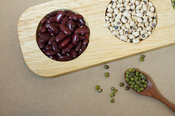 mixed beans on wood tray