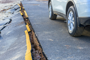 Damaged roads due to Car running.