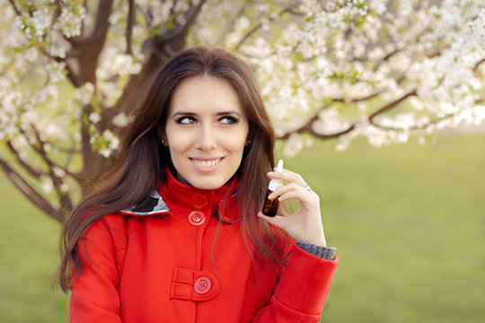 Smiling Woman with Respiratory Spray  in Spring Blooming Decor