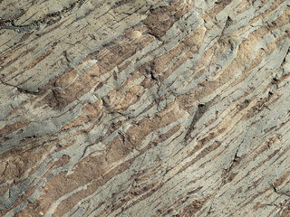 Grey strips on the surface of the stone.