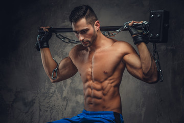 Athletic guy holding a hammer.