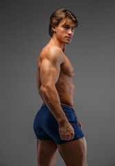 Fototapeta na wymiar Shirtless muscular man posing.