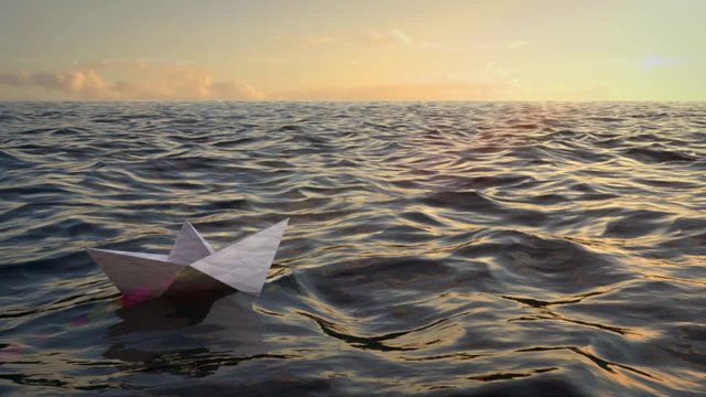 Paper origami ship floating on sea water