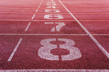 Running track closeup numbers eight in stadium