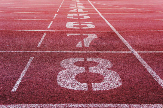 Running track closeup numbers eight in stadium
