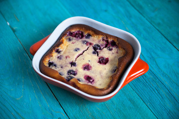 cheesecake with berries, baking, blue  background