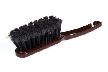 New brown broom for cleaning on white background