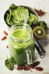 Healthy green smoothie and ingredients