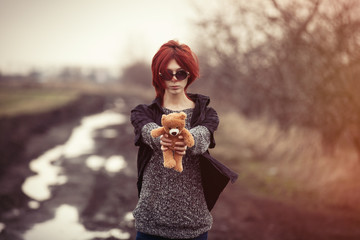 woman with teddy bear toy