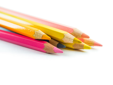 Photograph of an assortment of colored pencils seen from the side.