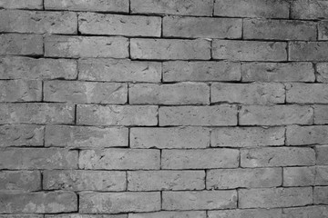 Old grunge brick wall background, while and black