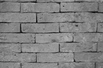 Old grunge brick wall background, while and black